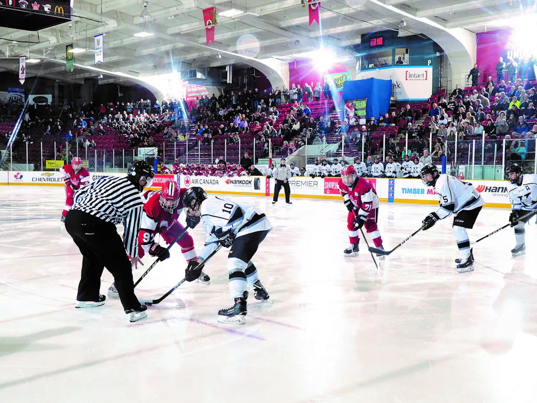 A photograph shows a puck drop at Fort William Gardens