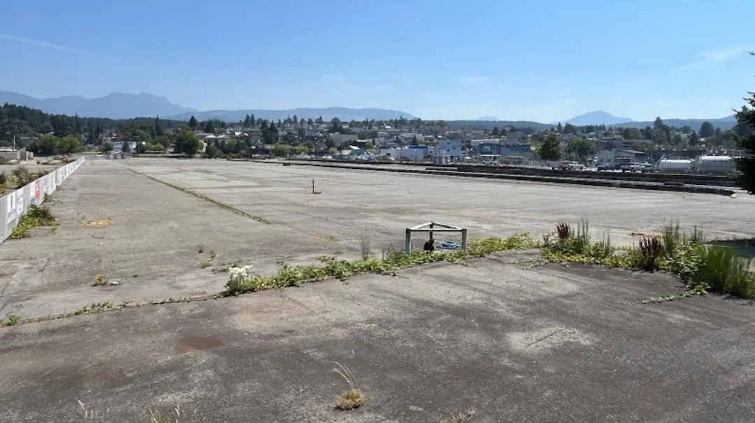 Cleared expanse of pavement at Somass Lands looking east to Mount Arrowsmith