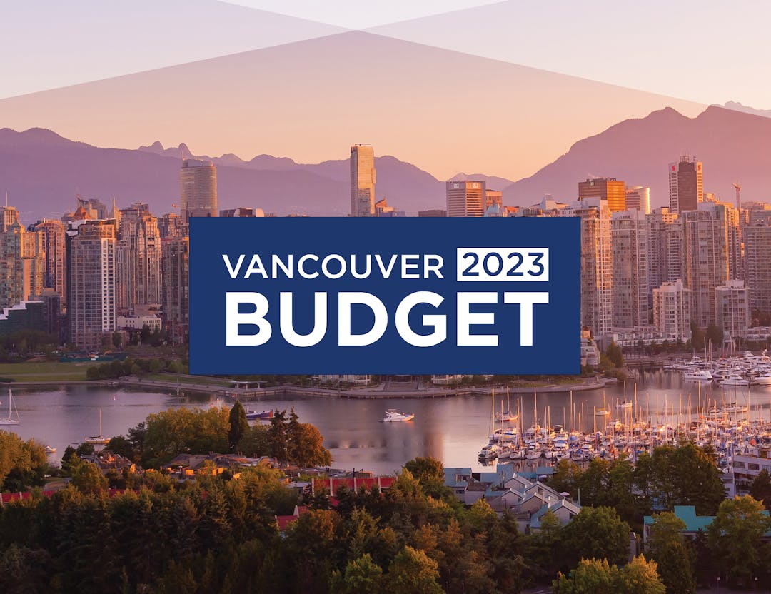 A north-facing Vancouver landscape is awash with sunset hues, behind a blue box with the words "Vancouver 2023 Budget"