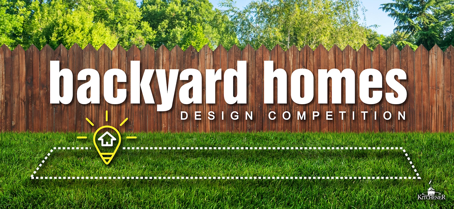 A grassy backyard bordered by a wooden fence with the competition logo overlaid on top