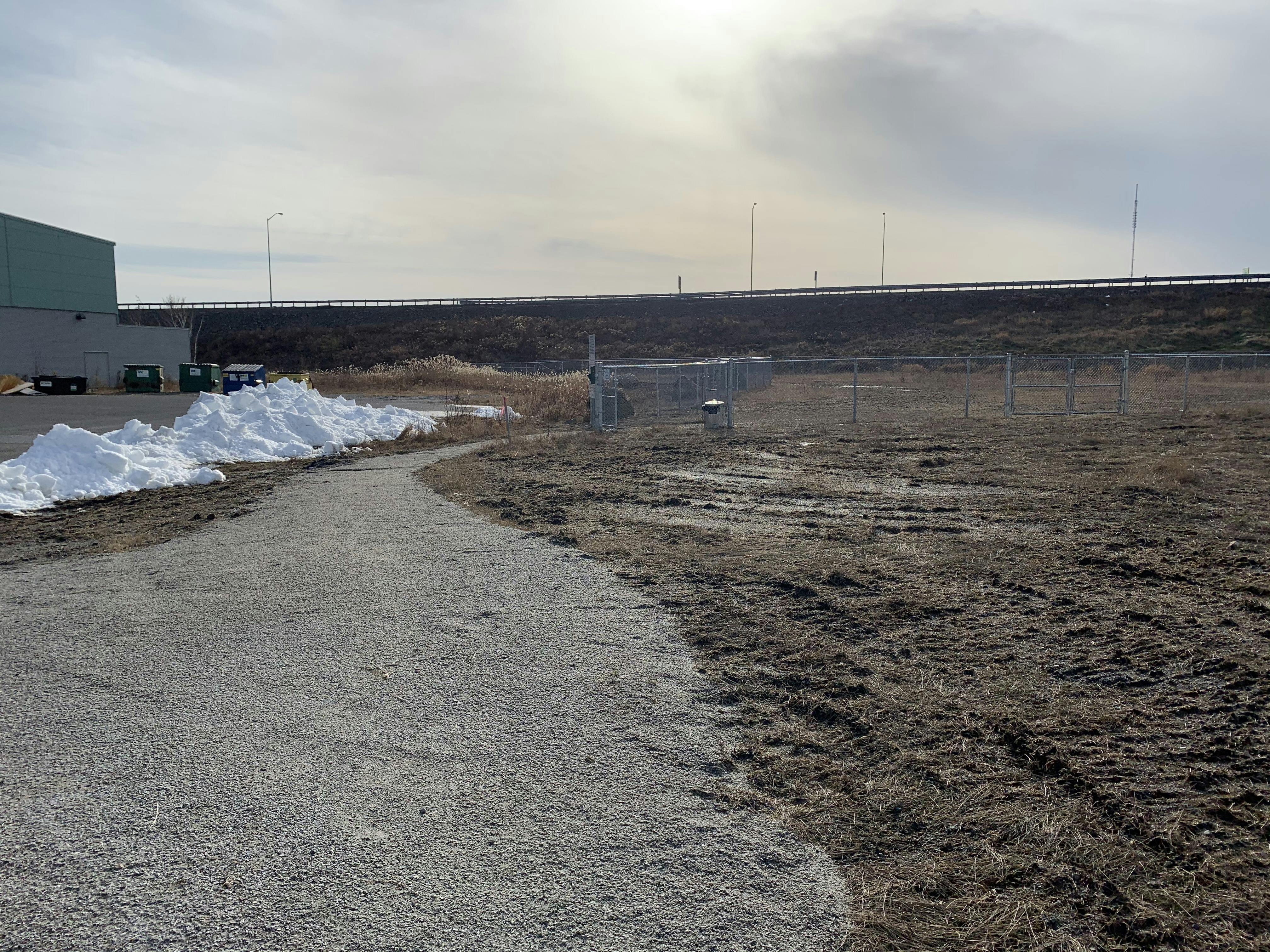 Pathway from small dog enclosure to large dog enclosure