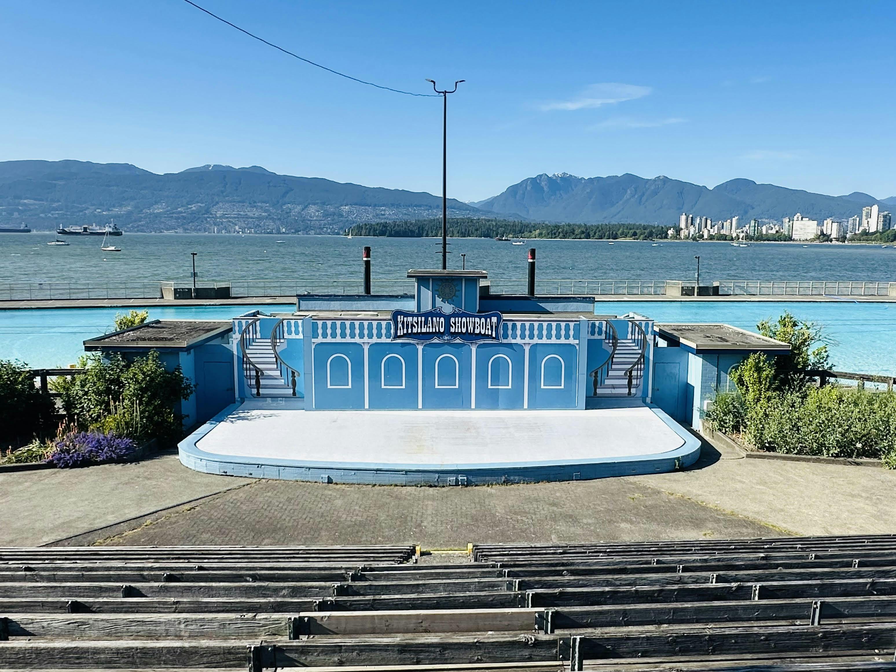 The Kitsilano community stage, also known as the Showboat, on a sunny day with the ocean and North Shore mountains in the background