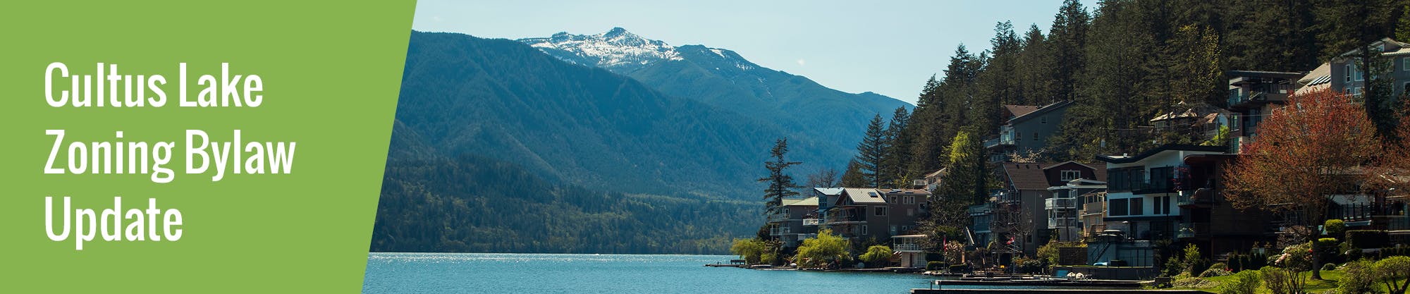 Image of Cultus Lake showing the lake, mountains and homes along the edge of the lake