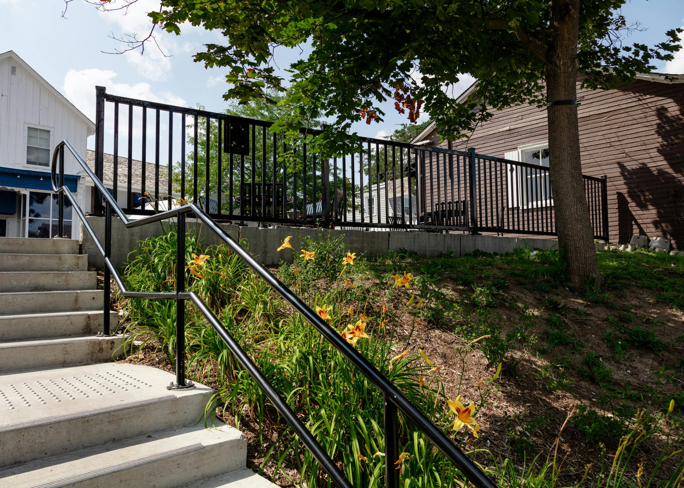 Fence - The fence is on either side of the stairs that lead to the parking lot. Photo by Laura Findlay.