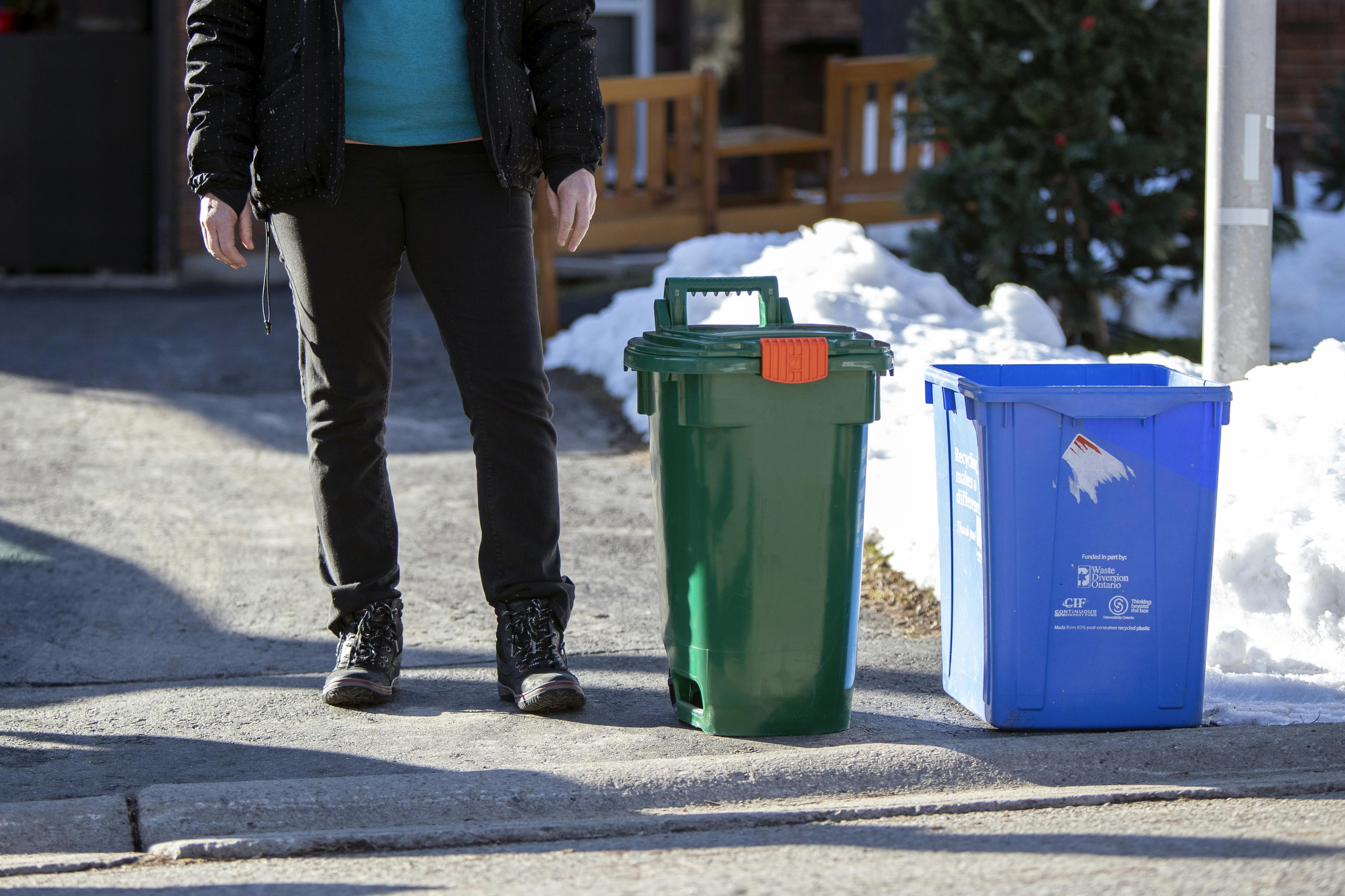A small size Green Bin placed at the curb