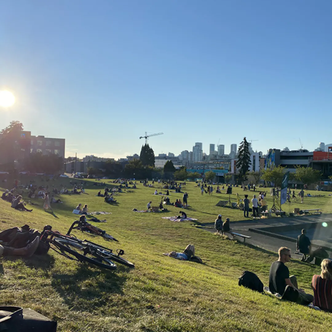 People relaxing in Jonathan Rogers park on a sunny day 