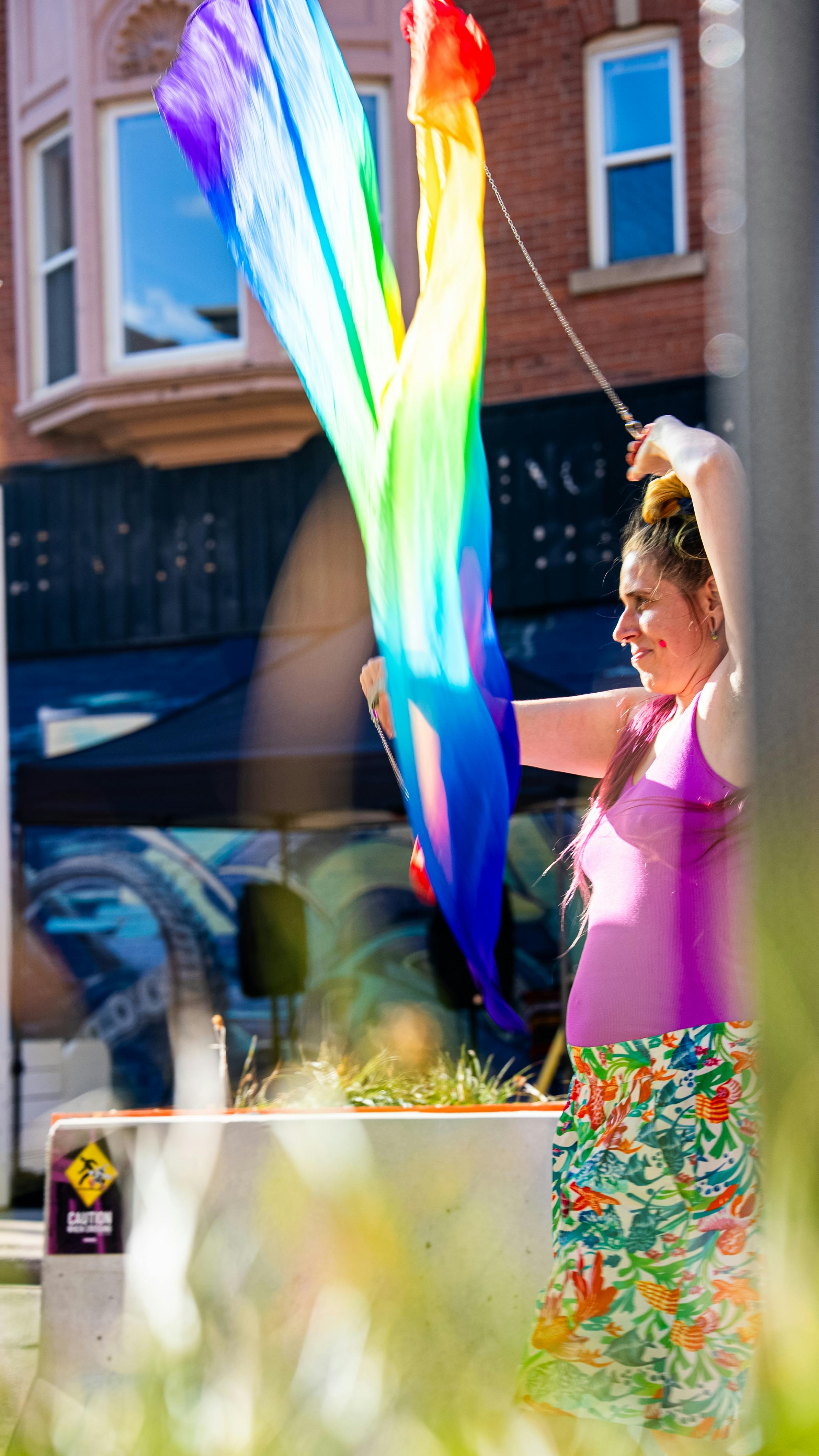 Person holding a long streaming kite. 