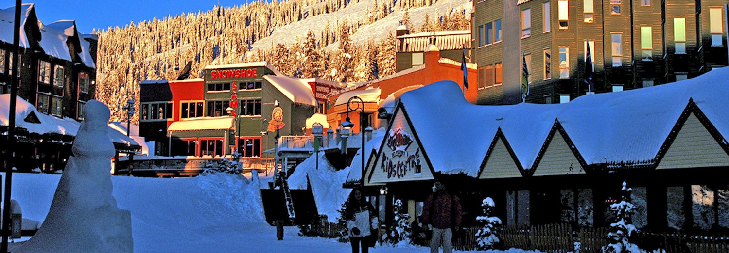Big White Resort Village and people walking through centre of the community.