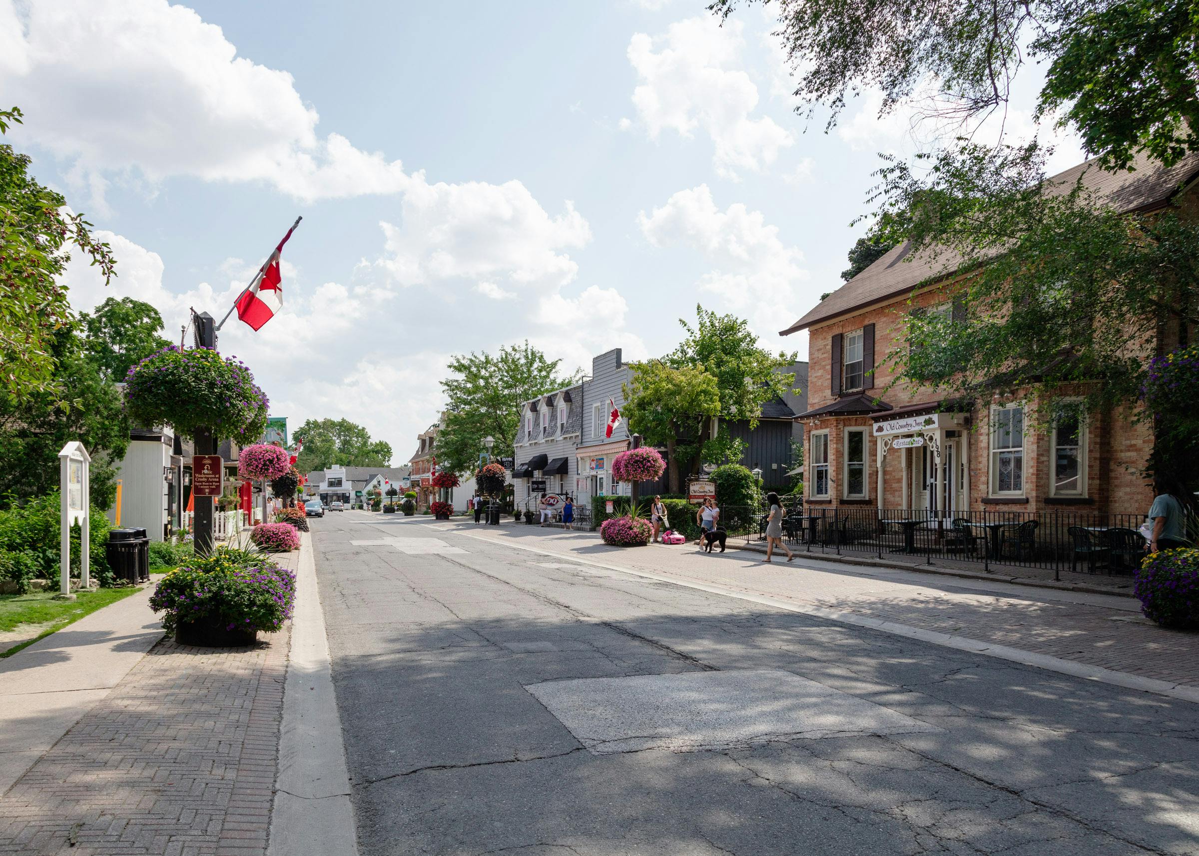 Streetscape - Main Street Unionville looking south. The revitalization will add space to the east side of the street, and reduce the sidewalk / parking space on the west side of the street. Photo by Laura Findlay.