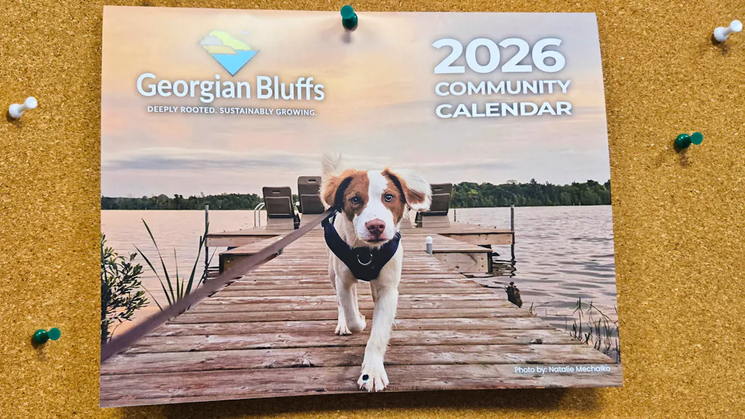 Picture of 2026 printed calendar front, with a dog on a dock