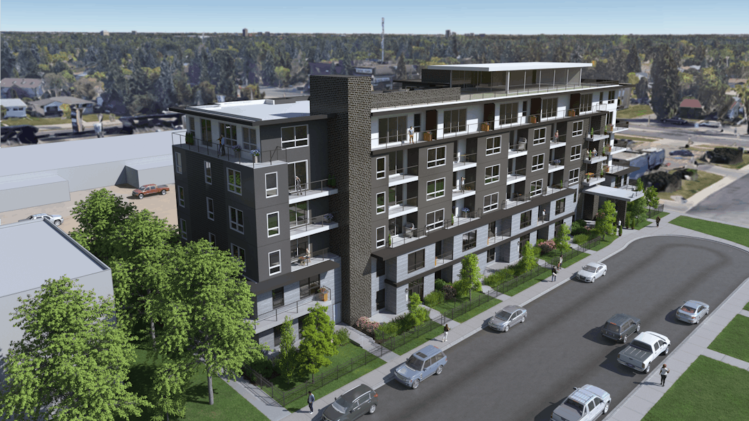 A colour image of the property that is proposed to be rezoned, showing a 6-storey building up close, from a birds-eye view above, looking down towards the building with a street in front of it