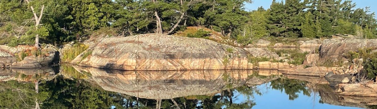 Granite Rocks reflecting in water