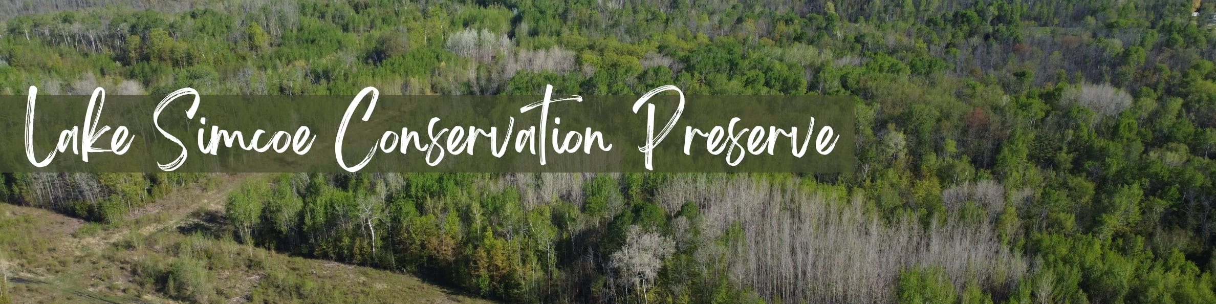 Text reading "Lake Simcoe Conservation Preserve" overlaid on an aerial image of a forest