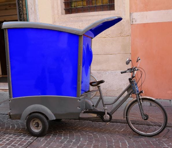 A tricycle cargo e-bike design with enclosed cargo box at the back