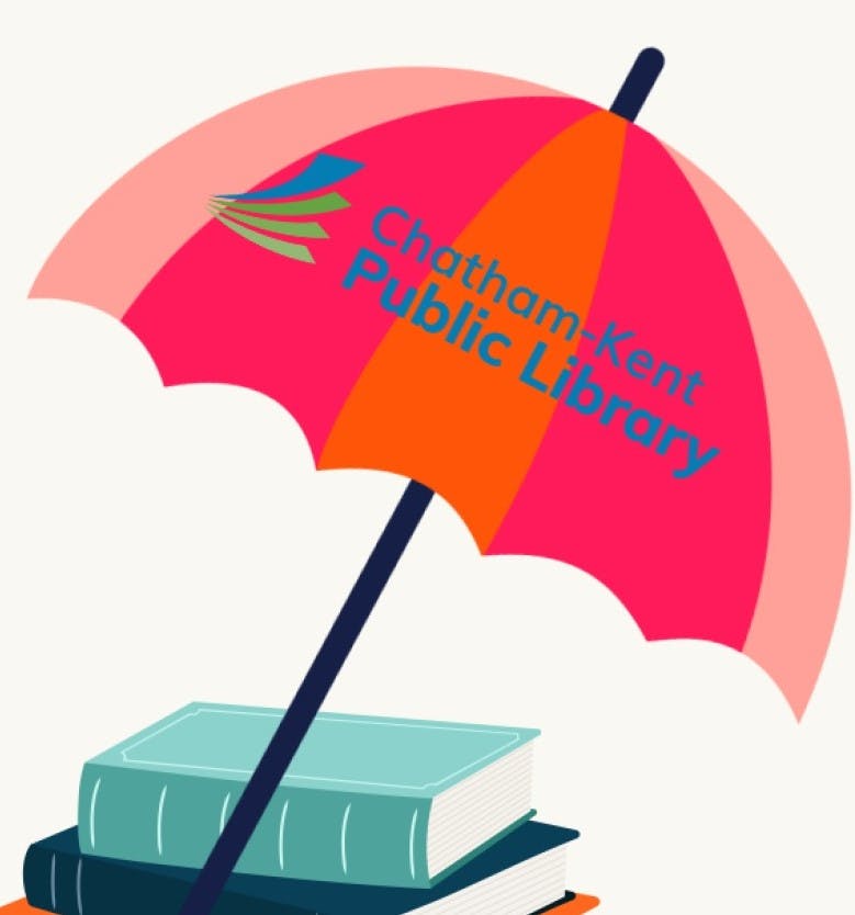 Stack of books with a beach umbrella, Chatham-Kent Public Library logo on umbrella. 
