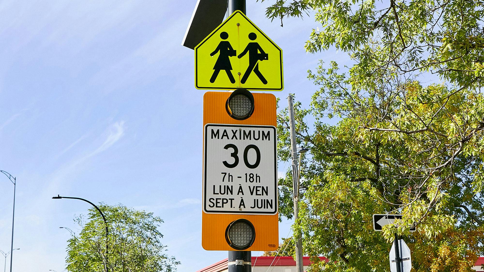 30 km/h school zone with flashing speed sign during school hours