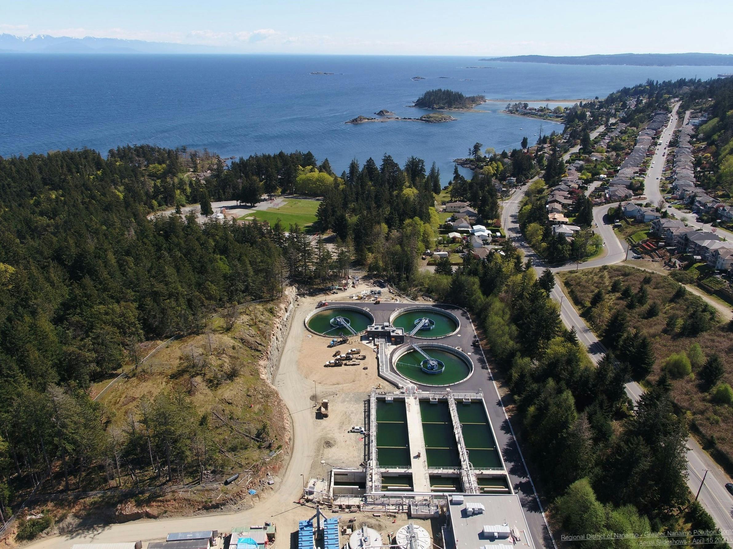 Secondary treatment tanks with a view towards Hammond Bay