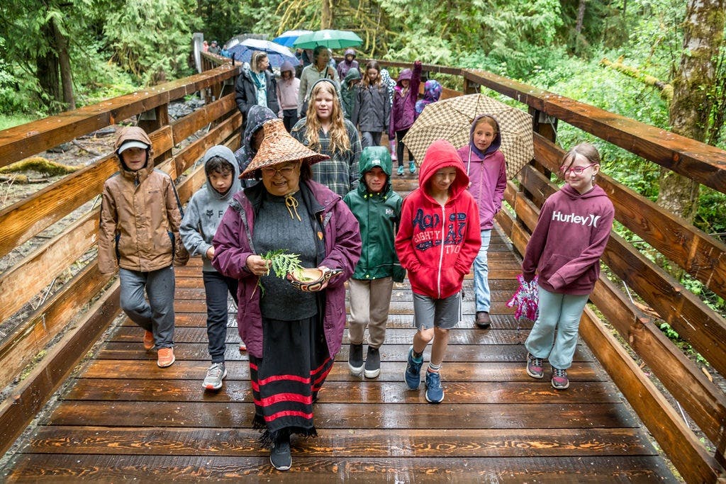Elder Jackie with school children.jpg