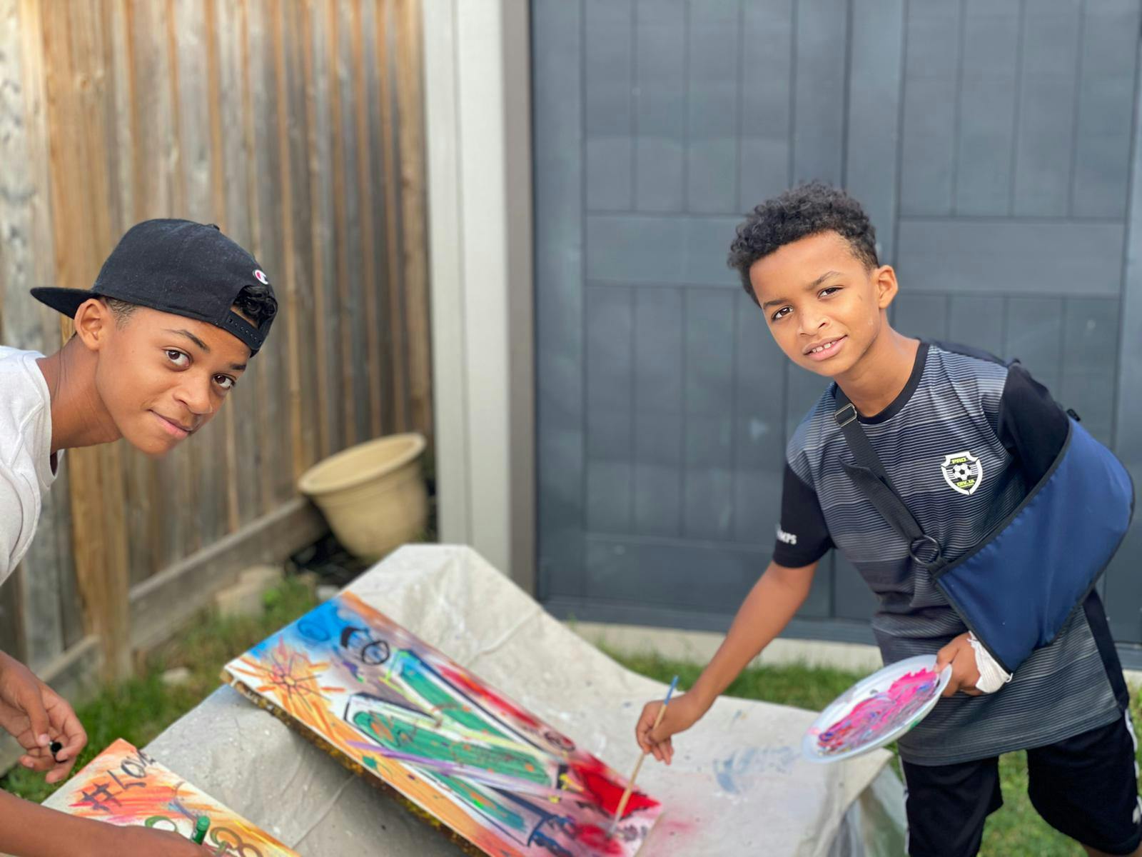 Two young participants painting.