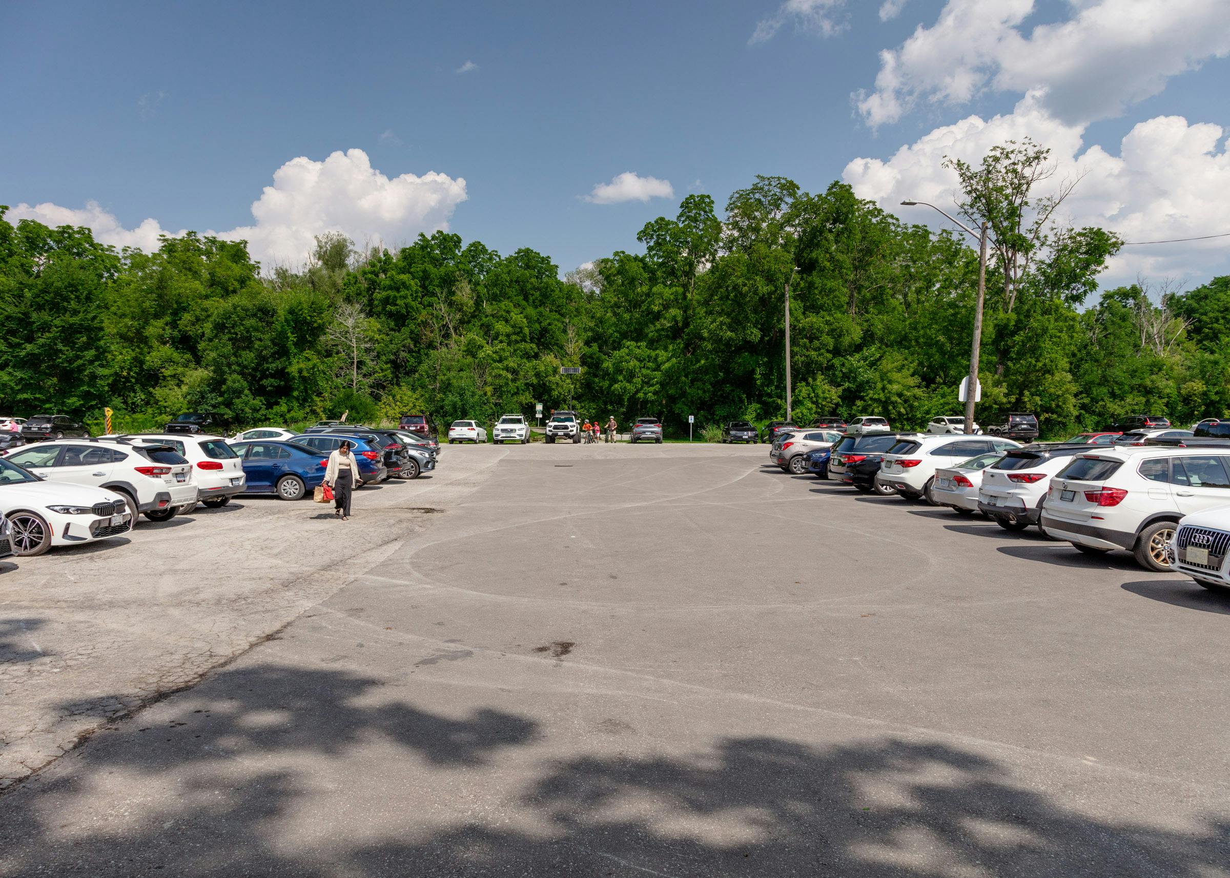 Pathway - View east through the parking lot towards the Rouge Trail entrance. Photo by Laura Findlay.