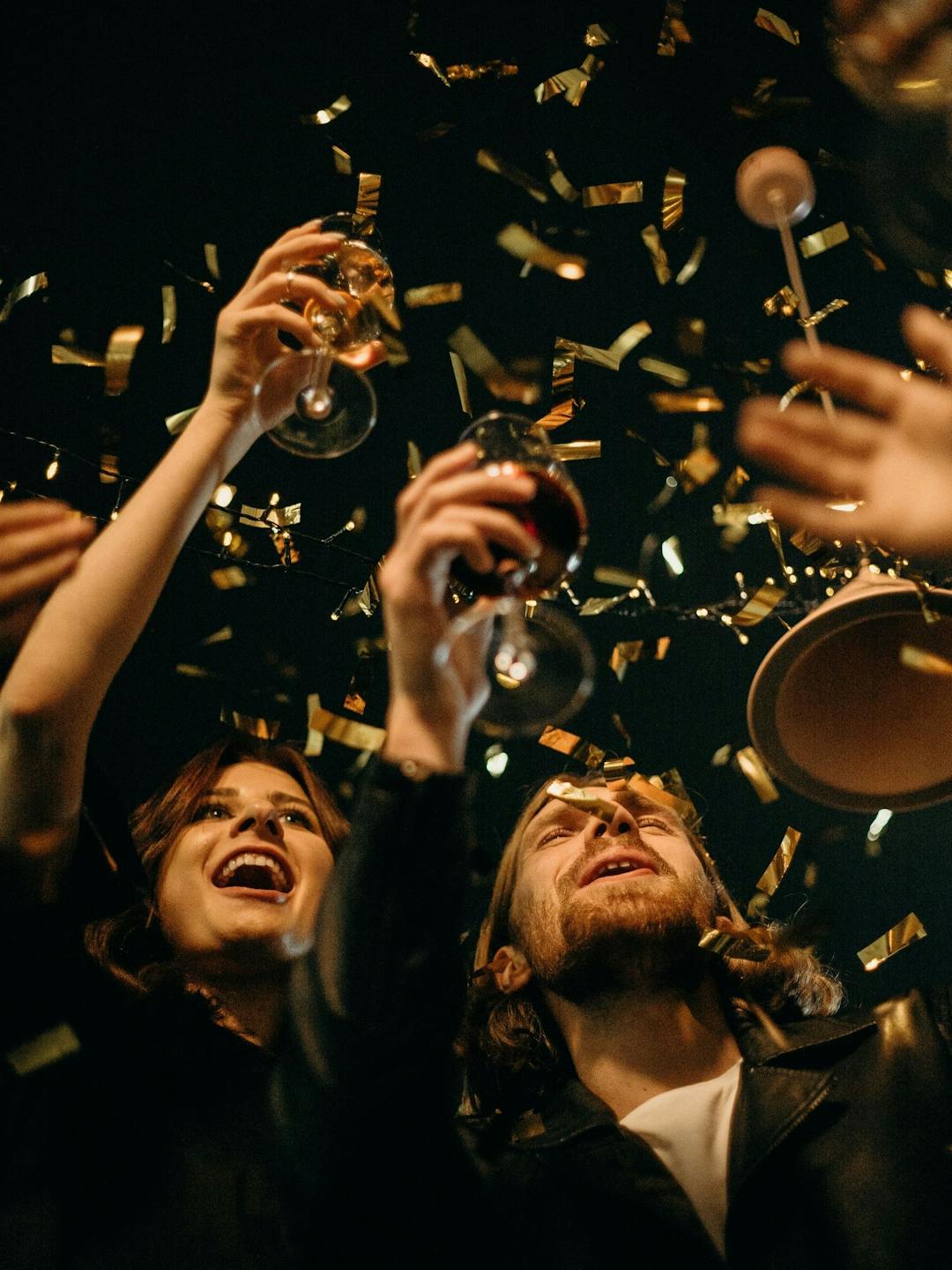People celebrating at a party with a toast.