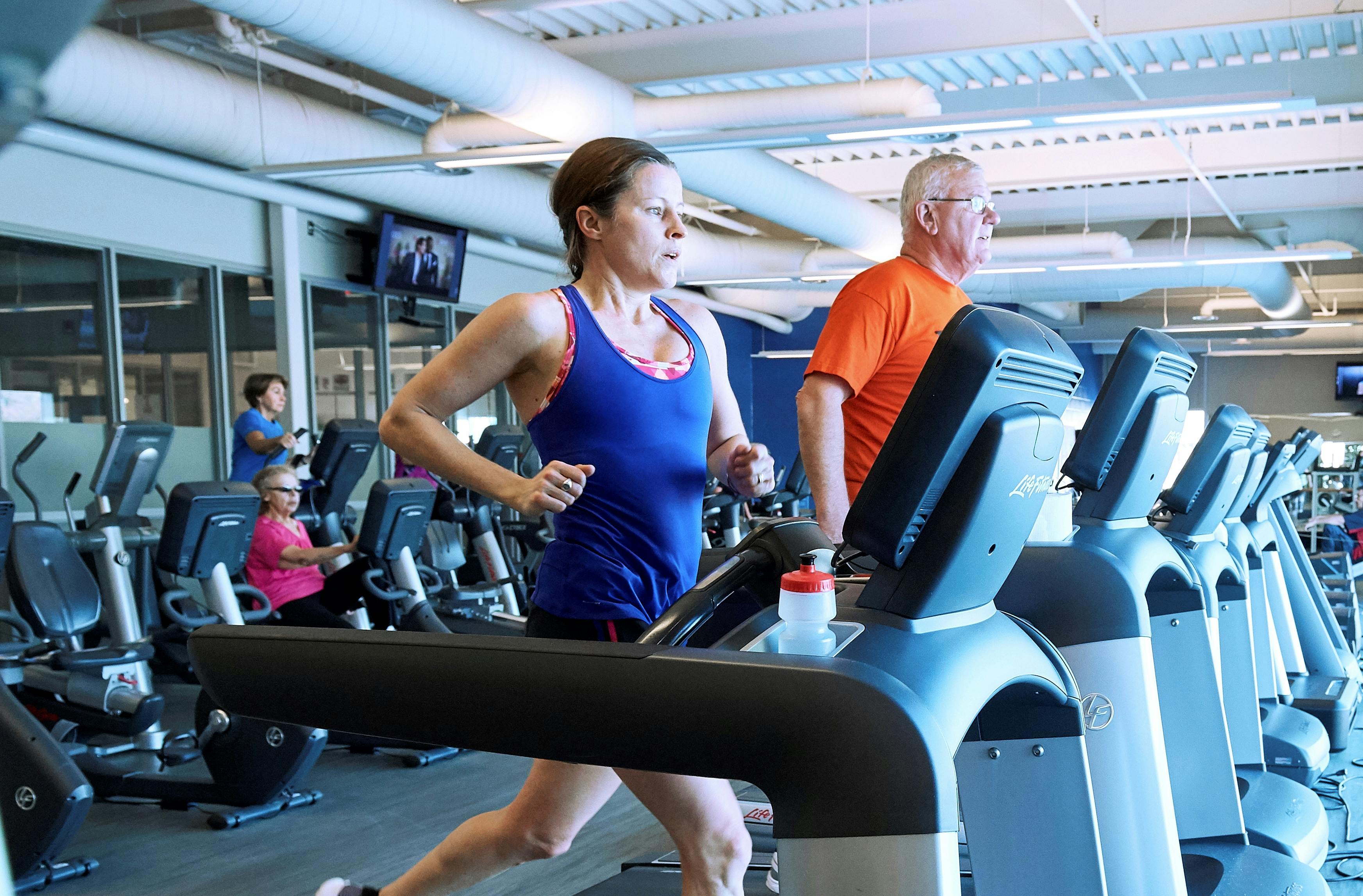 Weight room - people using cardio equipment