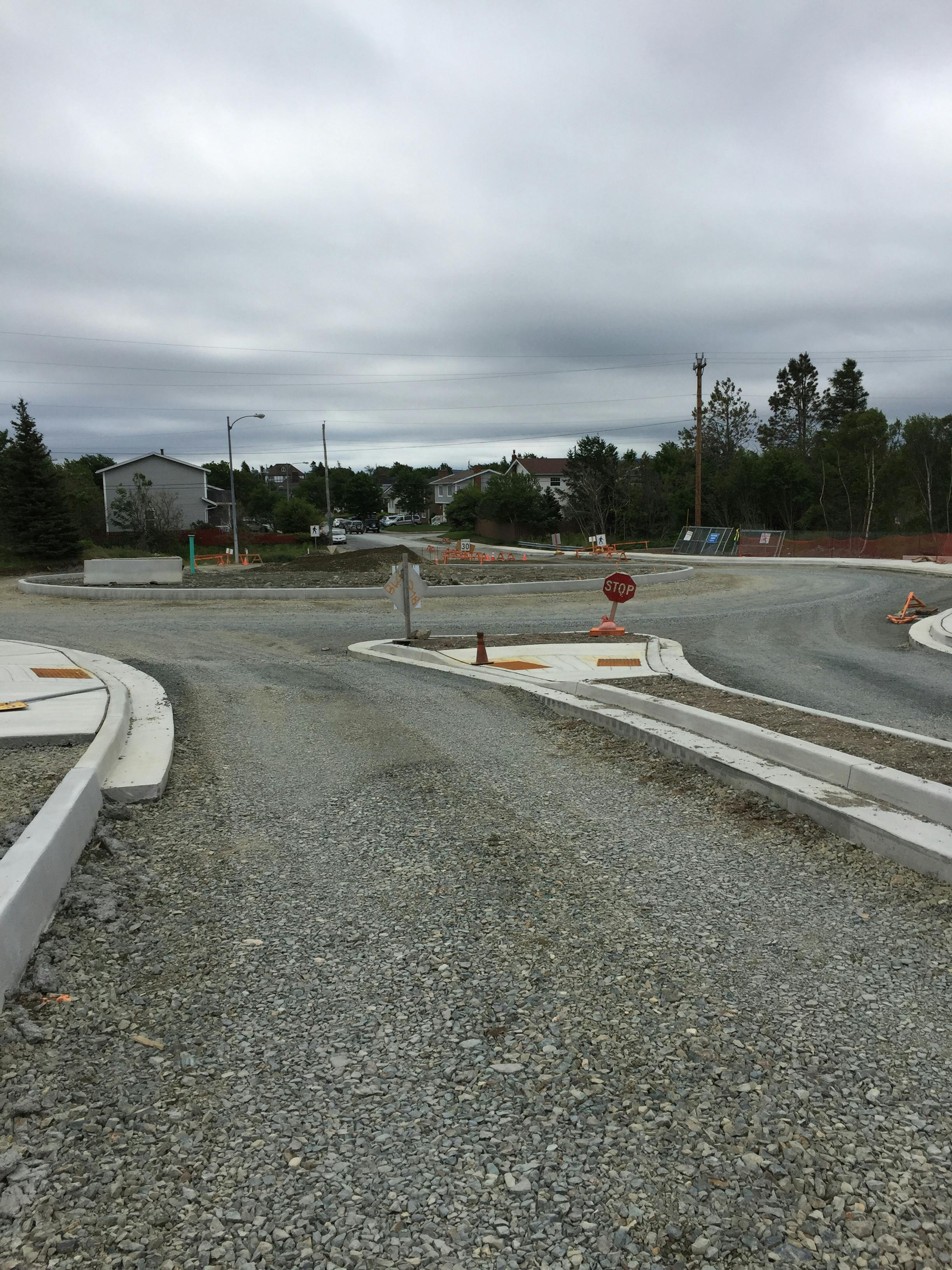 simple roundabout taking shape on Carrick Dr, July 20