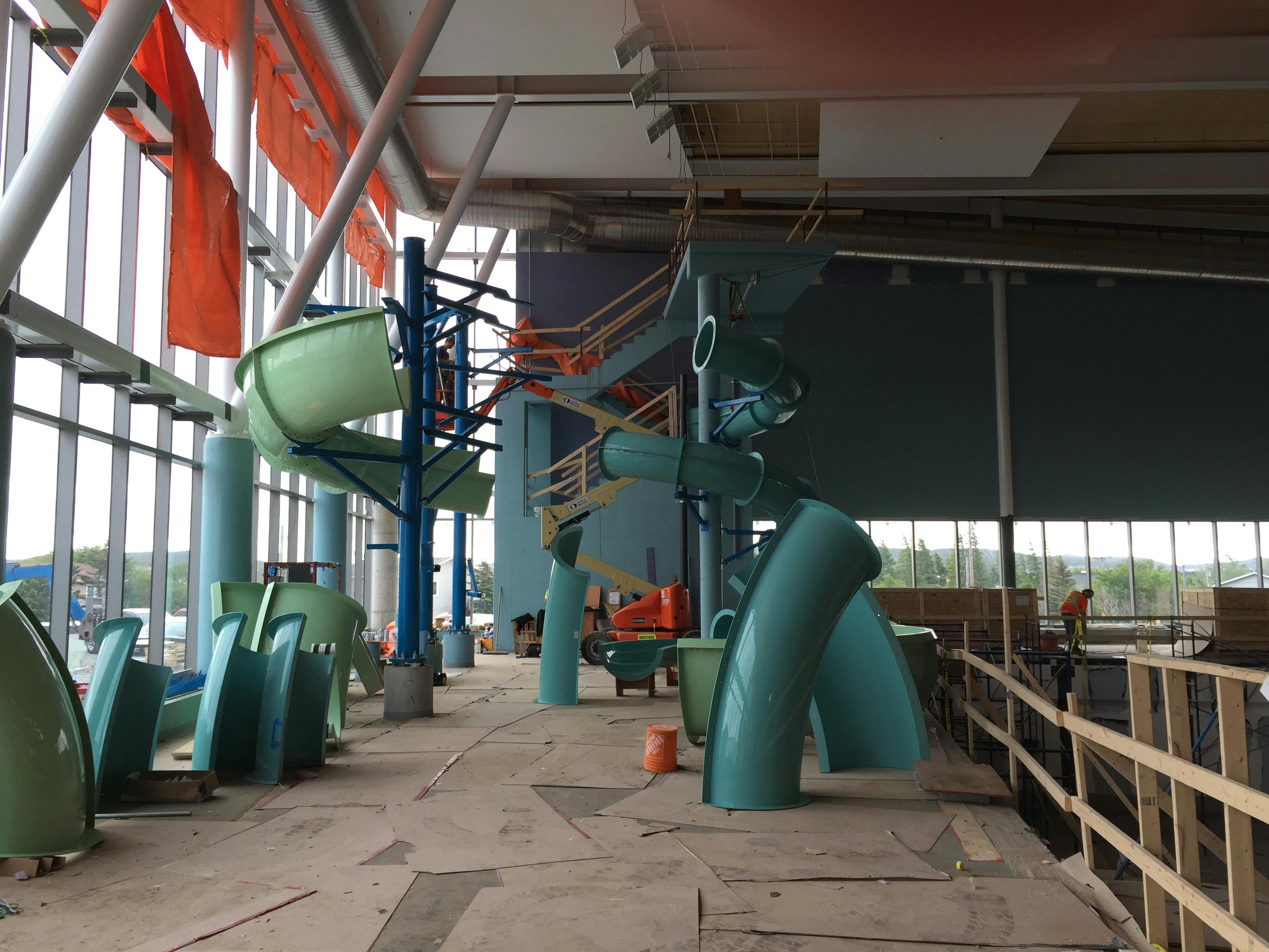 2 water slides being put together off the 8 metre tower June 22nd