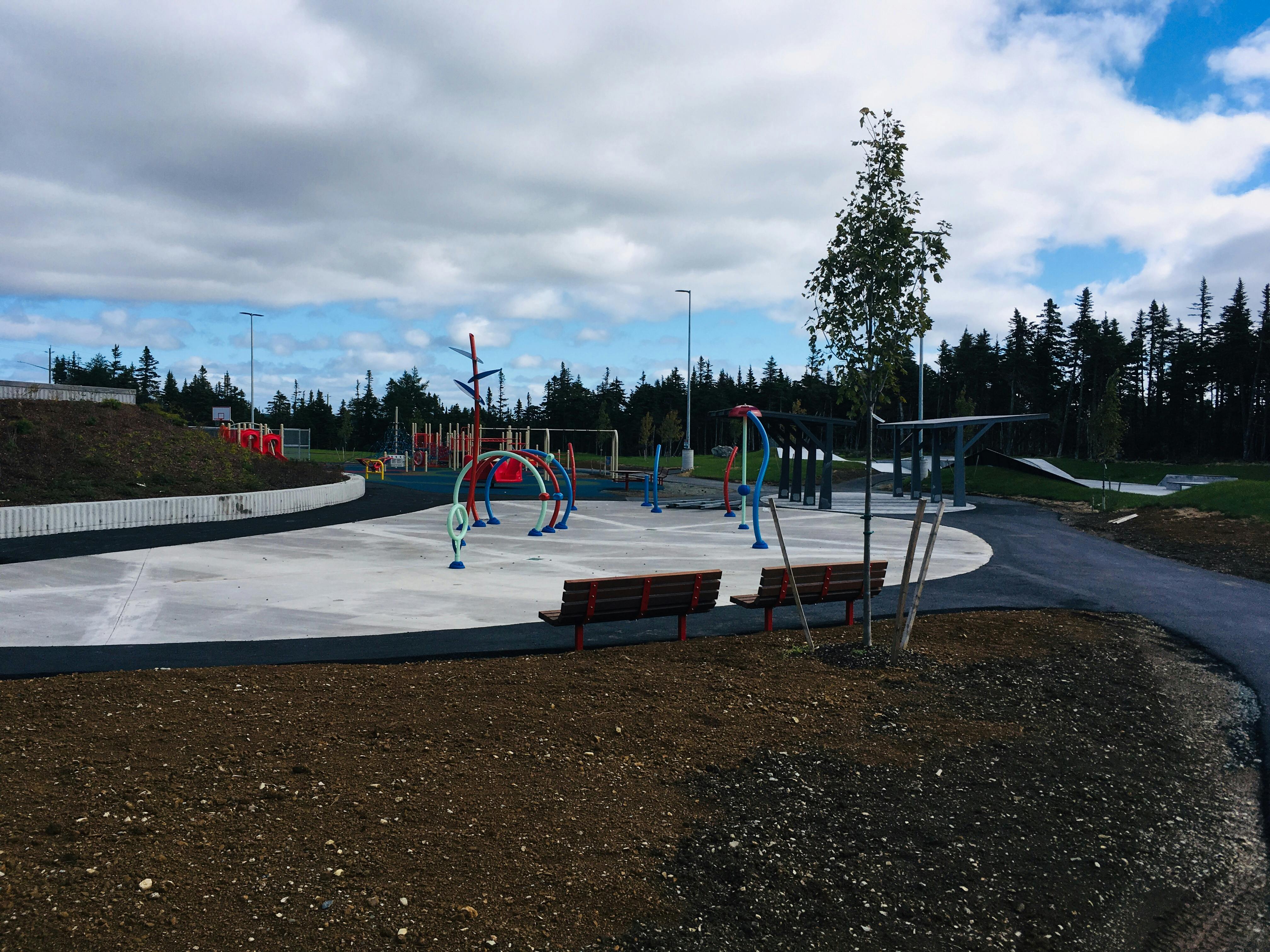 splash pad with playground area in background