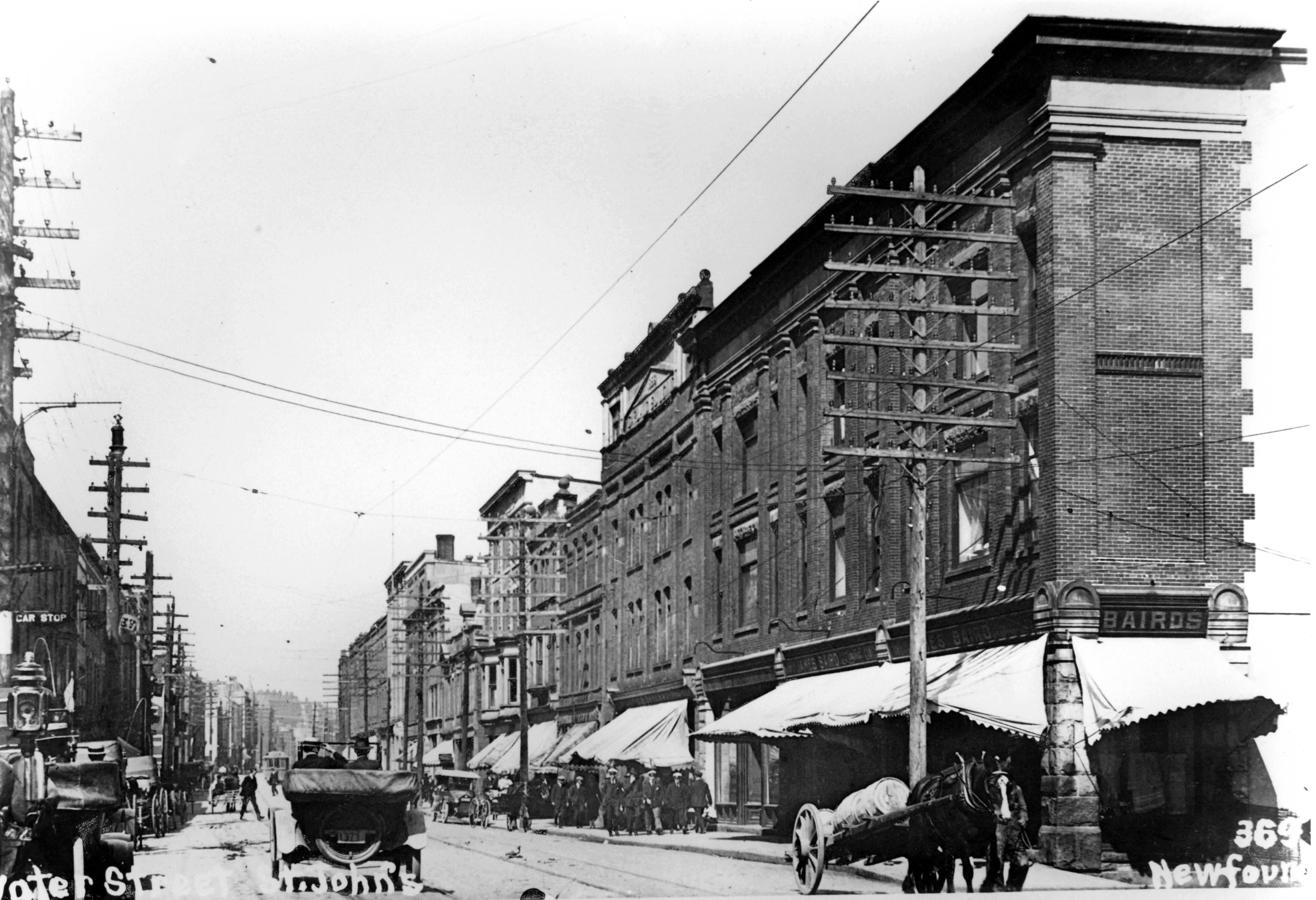 1910's: Water Street looking east from the foot of Market House Hill. Shown is the Baird Building at 187 Water Street.