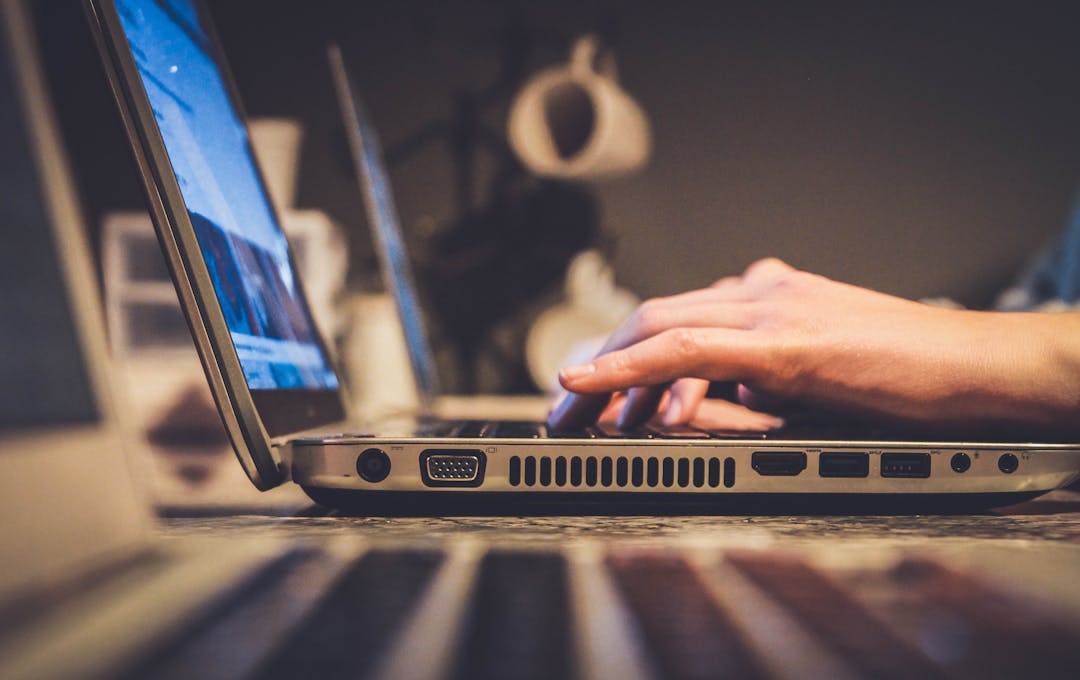 Person using laptop computer to check their emails.