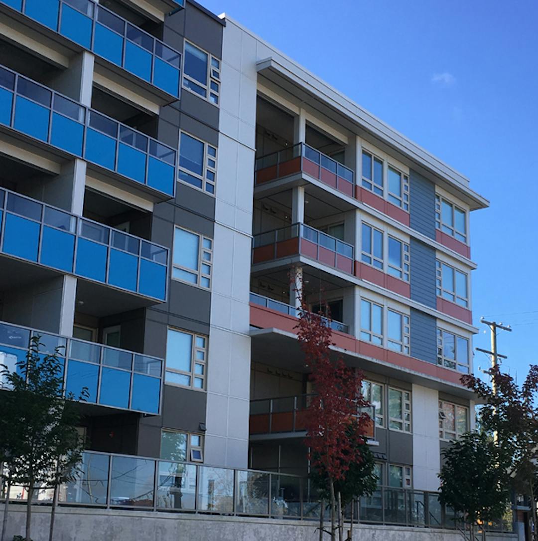 A modern, three-storey rental apartment building in Richmond.