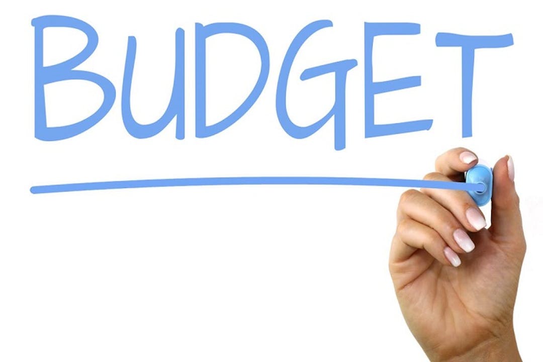 Let's Talk Budget The word Budget is spelled out in block letters and underlined